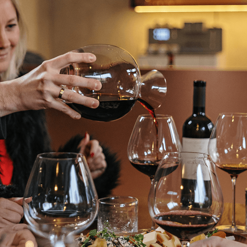 Person with red wine glass